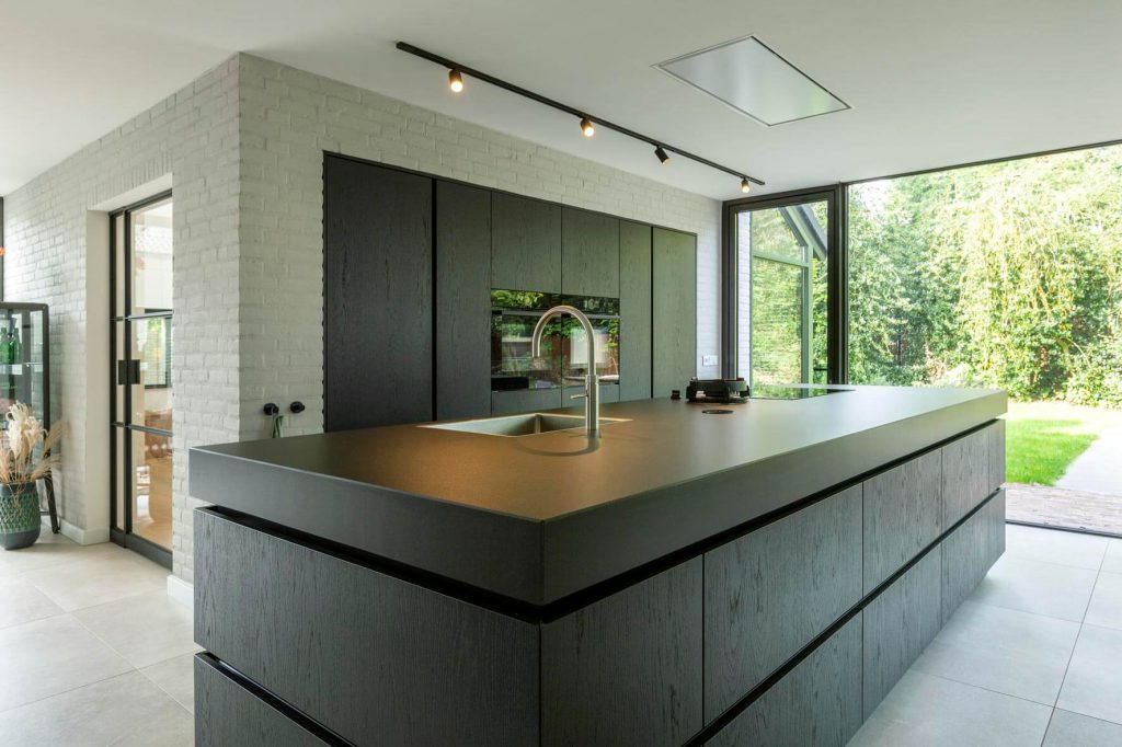 Moderne keuken, keuken laten maken, keuken bouwer, op maat keukens, op maat gemaakte keukens, luxe keukens, vogels keukens Helmond, Nuenen, Waalre, Stiphout, Liessel, Helmond, Eindhoven, Bladel, Pijnacker, Rotterdam Vlakinbouw inductiekookplaat - Keuken in Regio Rotterdam, Koperkleurige spoelbakRonde deuren hoge kast, Composiet werkblad, Recirculatie schuine afzuigkap, Ronde vormen bij keuken, Keukenblad van Balsabeton "Robuste", Apparatenwand met rustiek eiken fineer, Wandmeubel passend bij keuken, Keukeneiland met Balsabeton werkblad, Industriële keuken met betonnen blad, Quooker reservoir weggewerkt achter ladefrontenDoorlopende houtnerf in fronten, Twist stopcontact in werkblad, Betonnen aanrechtblad met vlakinbouw kookplaat, Kookeiland met eiken fineer greeplijsten, Schiereiland met laden push-to-open, Inductiekookplaat met geïntegreerde afzuiging, Elektrische push-to-open op een koelkast,RVS keukenblad met vlakinbouw inductiekookplaat, Maatkeuken in Utrecht, Volledig geïntegreerde spoelbak in rvs keukenblad, Knoppen Bora Professional, Bora geïntegreerde afzuiging, Bora Professional, Oven onder het aanrechtblad, RVS keukenblad met spuitwerk fronten, luxe keukenapparatuur in maatwerk keuken, digitale tekening keuken op maat, technische tekening kastenwand, stopcontacten maatwerk kookeiland, besteklade op maat keuken, modern rvs keukenblad werkblad op maat, landelijke keuken op maat met kookeiland, maatwerk rvs keukenblad met glazen achterwand, smeg koelkast in moderne maatwerk keuken, deurrek kastsysteem in staande keukenkast op maat, lemans keukensysteem keukenkast, afvalemmers en afvalsortering kastsysteem keukens, apothekerskast keukenkastsysteem, magic corner keukenkastsysteem, technische tekening keuken op maat, sample materialen keuken op maat, luxe keukenkast op maat met spuitwerk, moderne abstracte keukenkast op maat, luxe maatwerk keuken met kastenwand, greeploze keuken op maat, zwarte quooker kraan met spoelbak,push-to-open lade moderne keuken, meerdere binnenladen kastsysteem in moderne maatwerk keuken, natuursteen maatwerk stollenwand, liebherr wijnklimaatkast in moderne keuken op maat,bora kookplaat met ingebouwde afzuiging, natuursteen stollenwand en greeploze keukenkast, moderne mat zwarte quooker kraan en spoelbak, keuken kastenwand met inbouwapparatuur, maatwerk keuken met natuurstenen keukenblad, hout look keuken op maat,houten maatwerk keuken met tegel achterwand, moderne verlichting in houden keuken op maat,landelijke houten keuken op maat met moderne verlichting, maatwerk keuken kopen Bergen op Zoom